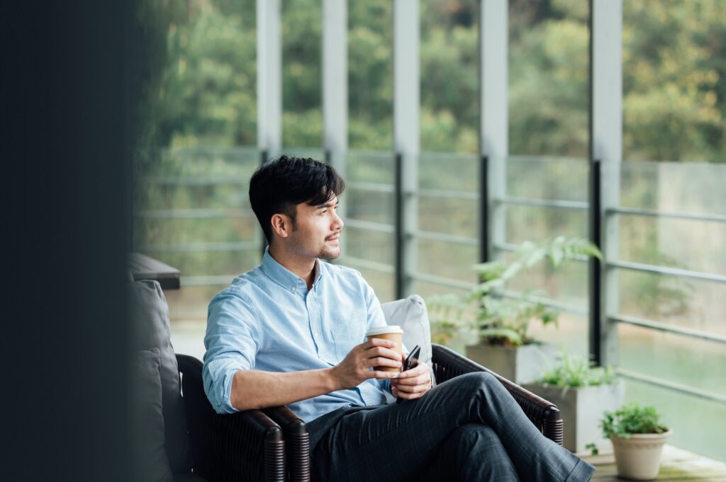 Asian businessman sitting at office window